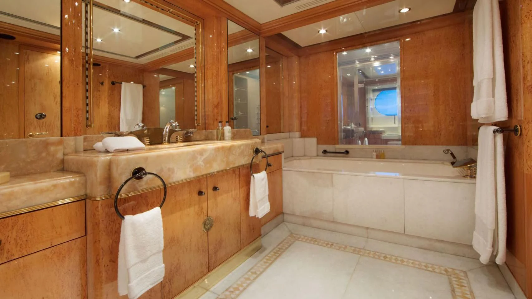 a bathroom with a large mirror aboard CODE 8 Yacht for Sale