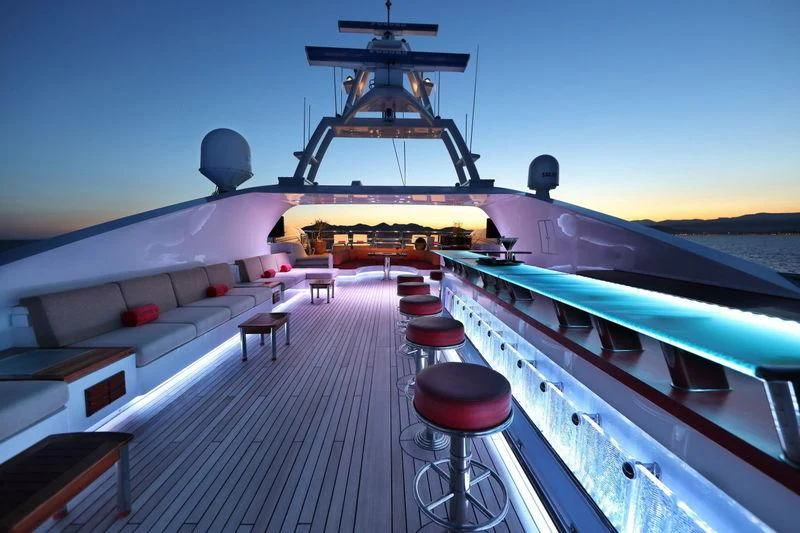a boat with a stool on the deck aboard CODE 8 Yacht for Sale