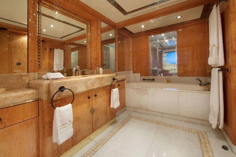 a bathroom with a large mirror aboard CODE 8 Yacht for Sale