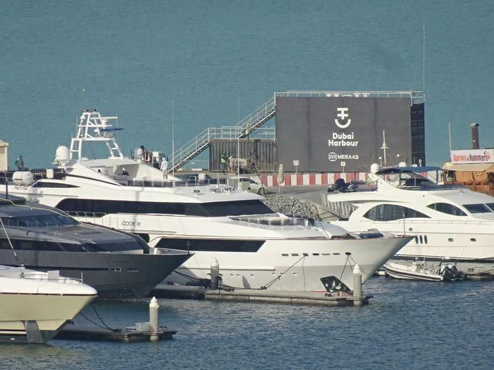 several white yachts in the water aboard CODE 8 Yacht for Sale