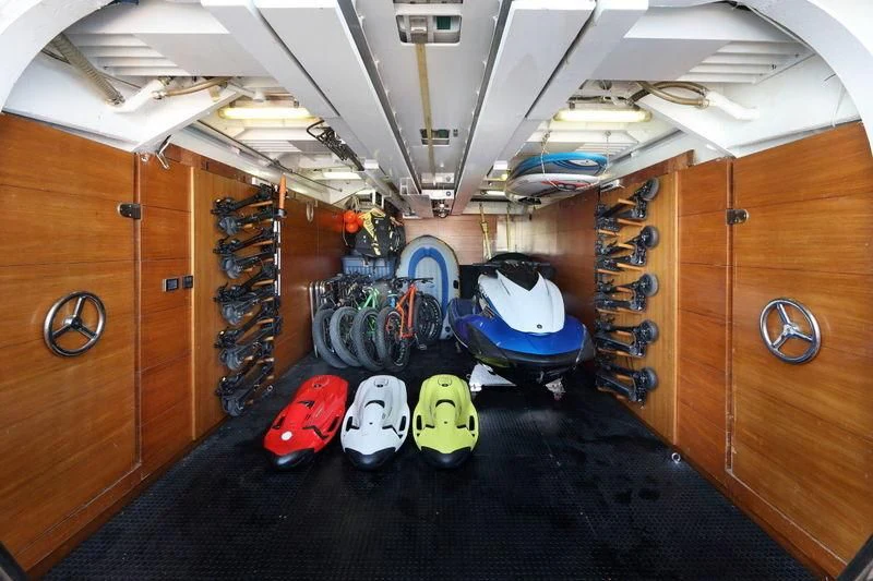 a room with a large group of tires and a large fan aboard CODE 8 Yacht for Sale