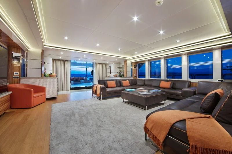 a living room with a large window aboard CODE 8 Yacht for Sale