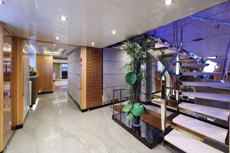a modern looking room with a plant in a potted plant aboard CODE 8 Yacht for Sale