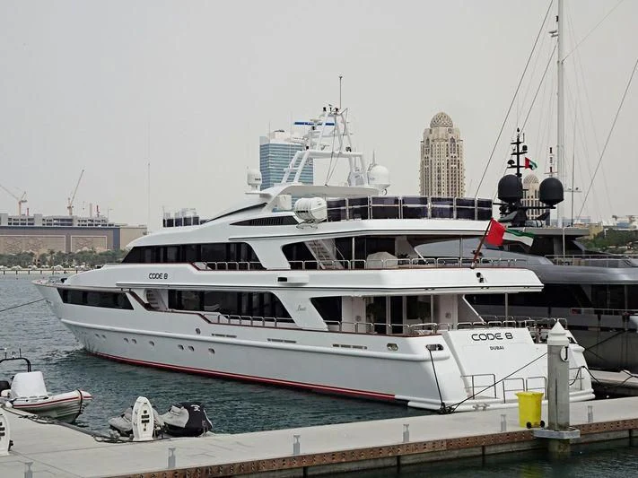 a boat docked at a pier aboard CODE 8 Yacht for Sale