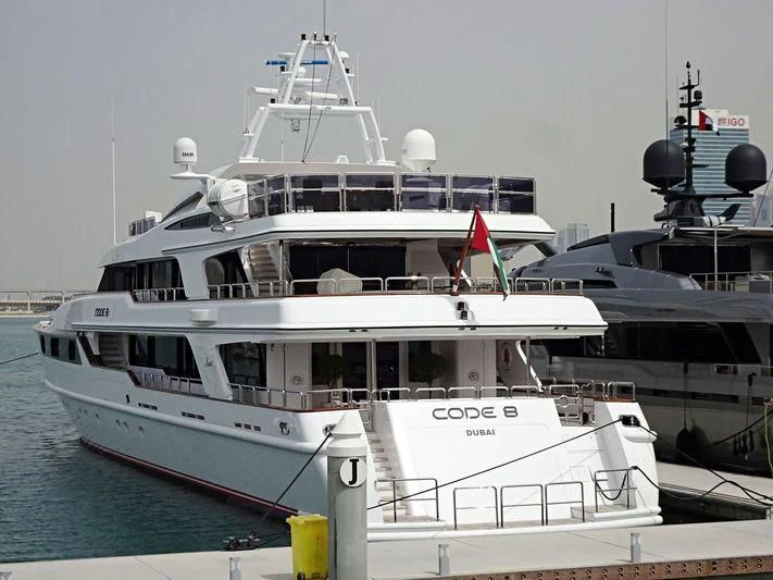 a boat docked at a pier aboard CODE 8 Yacht for Sale