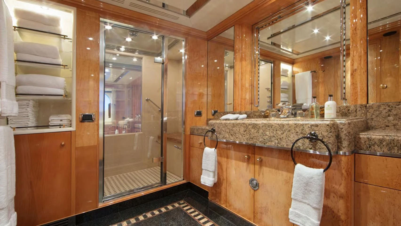 a bathroom with a glass shower aboard CODE 8 Yacht for Sale