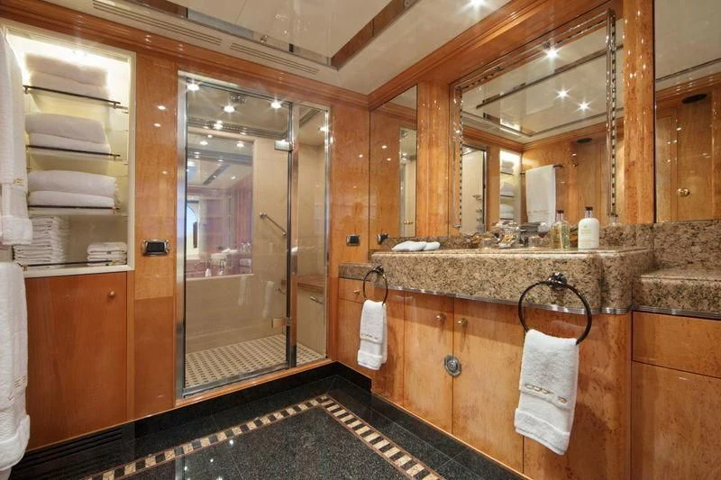 a bathroom with a glass shower aboard CODE 8 Yacht for Sale