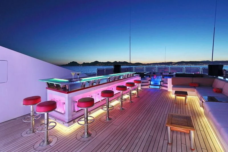 a pool table with stools aboard CODE 8 Yacht for Sale