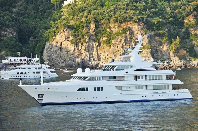 a couple of white yachts in the water aboard PARAFFIN Yacht for Sale