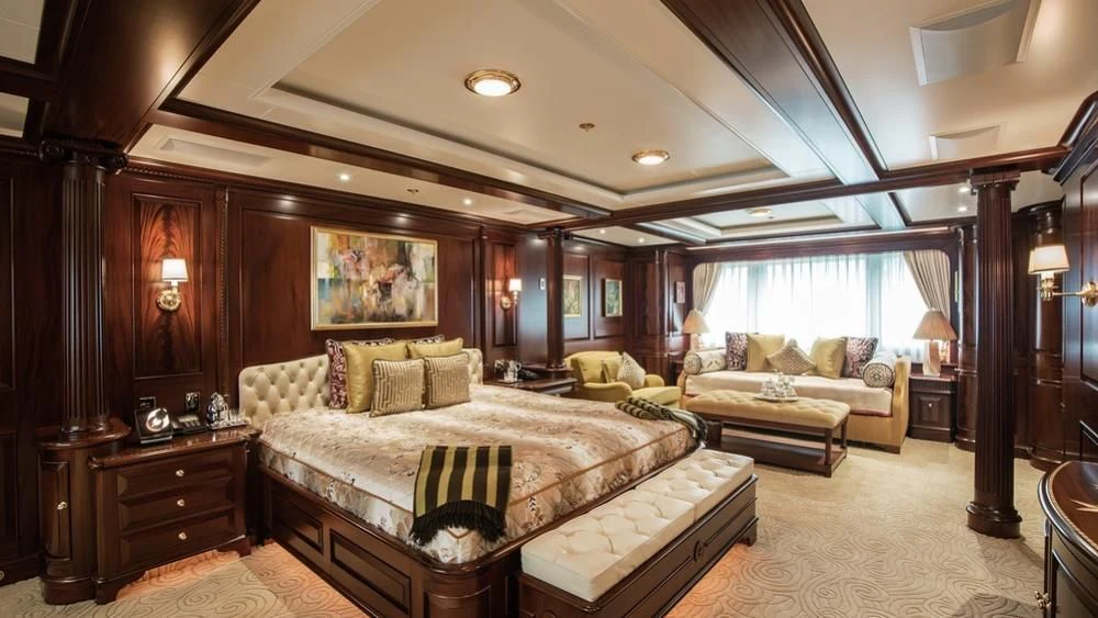 a large bedroom with a large bed aboard PARAFFIN Yacht for Sale