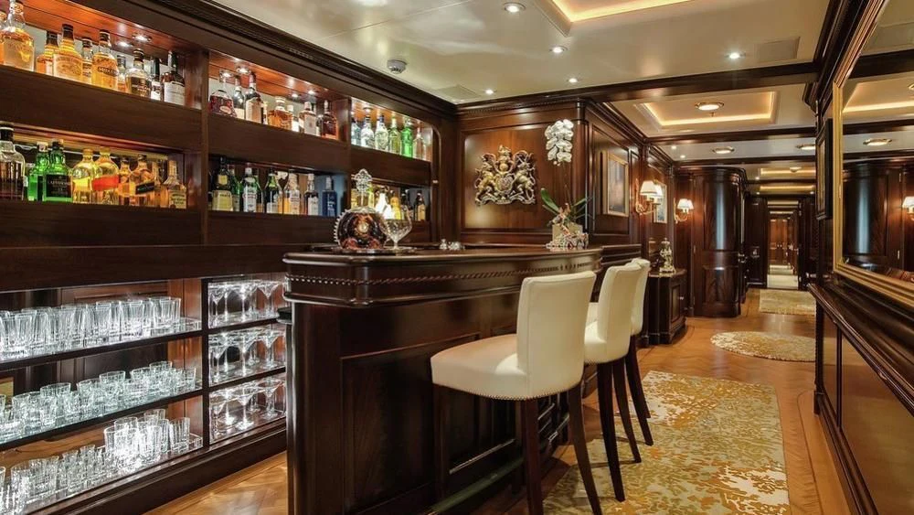 a bar with a bar and shelves aboard PARAFFIN Yacht for Sale