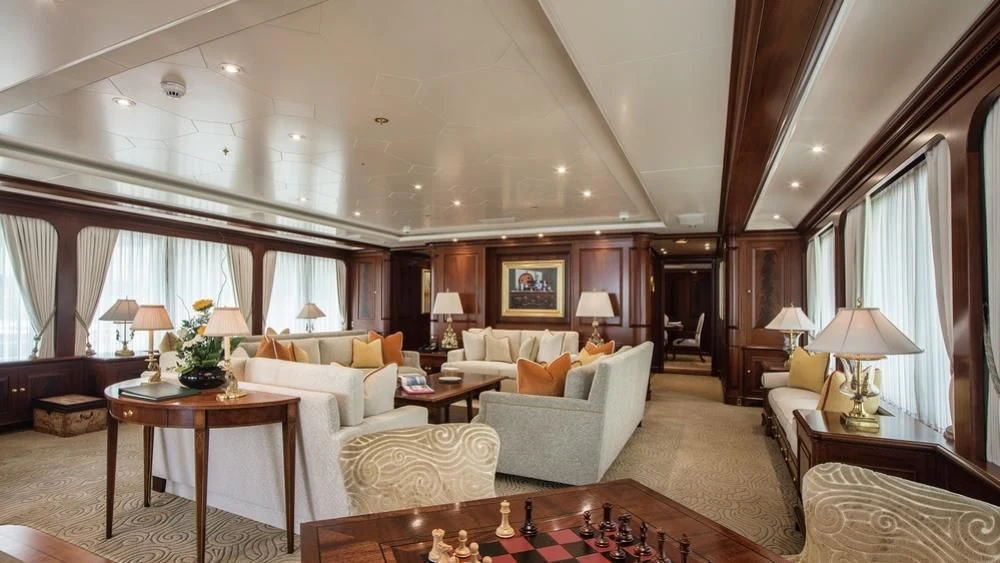 a living room with a large window aboard PARAFFIN Yacht for Sale