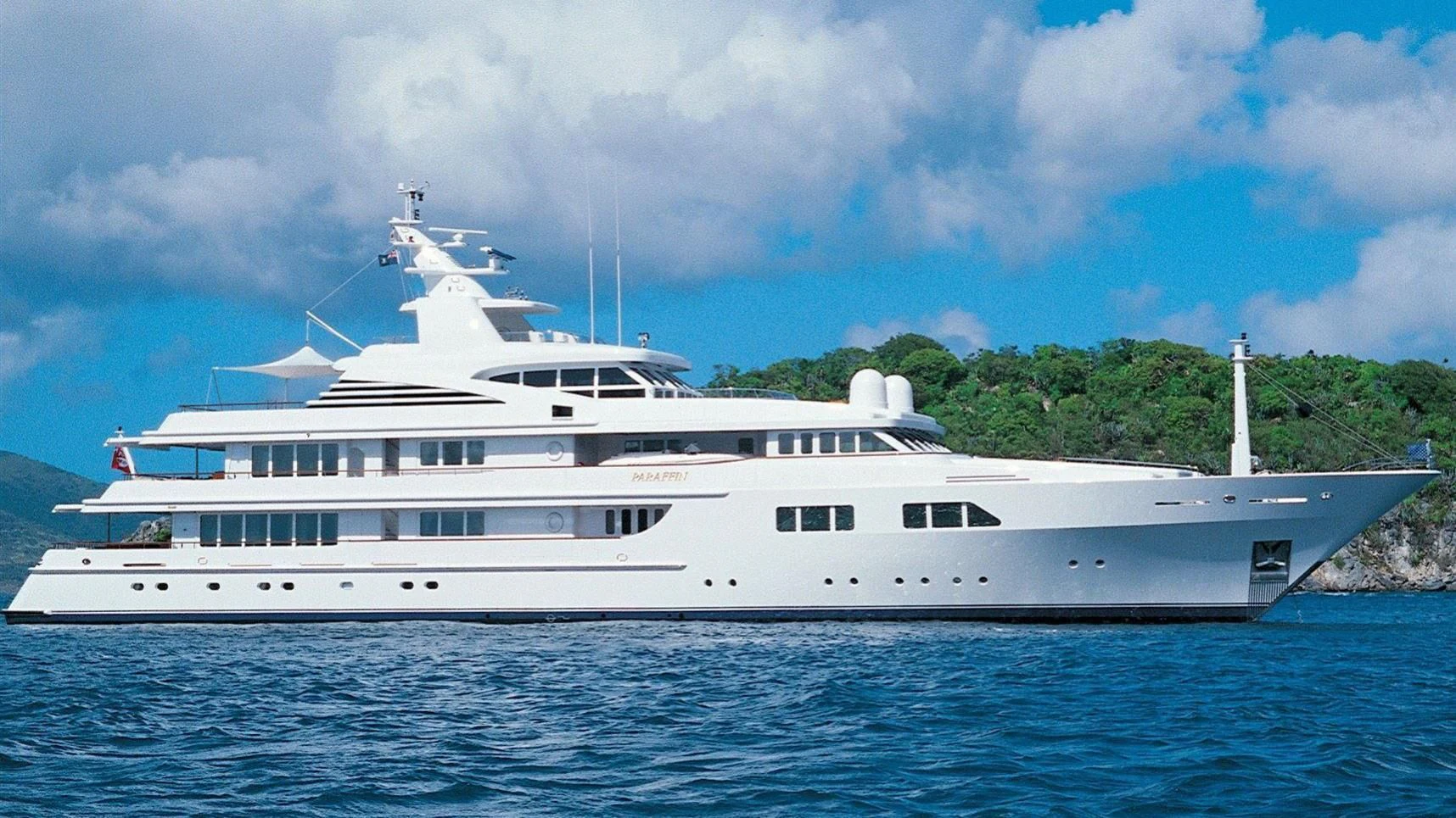 a large white boat in the water aboard PARAFFIN Yacht for Sale