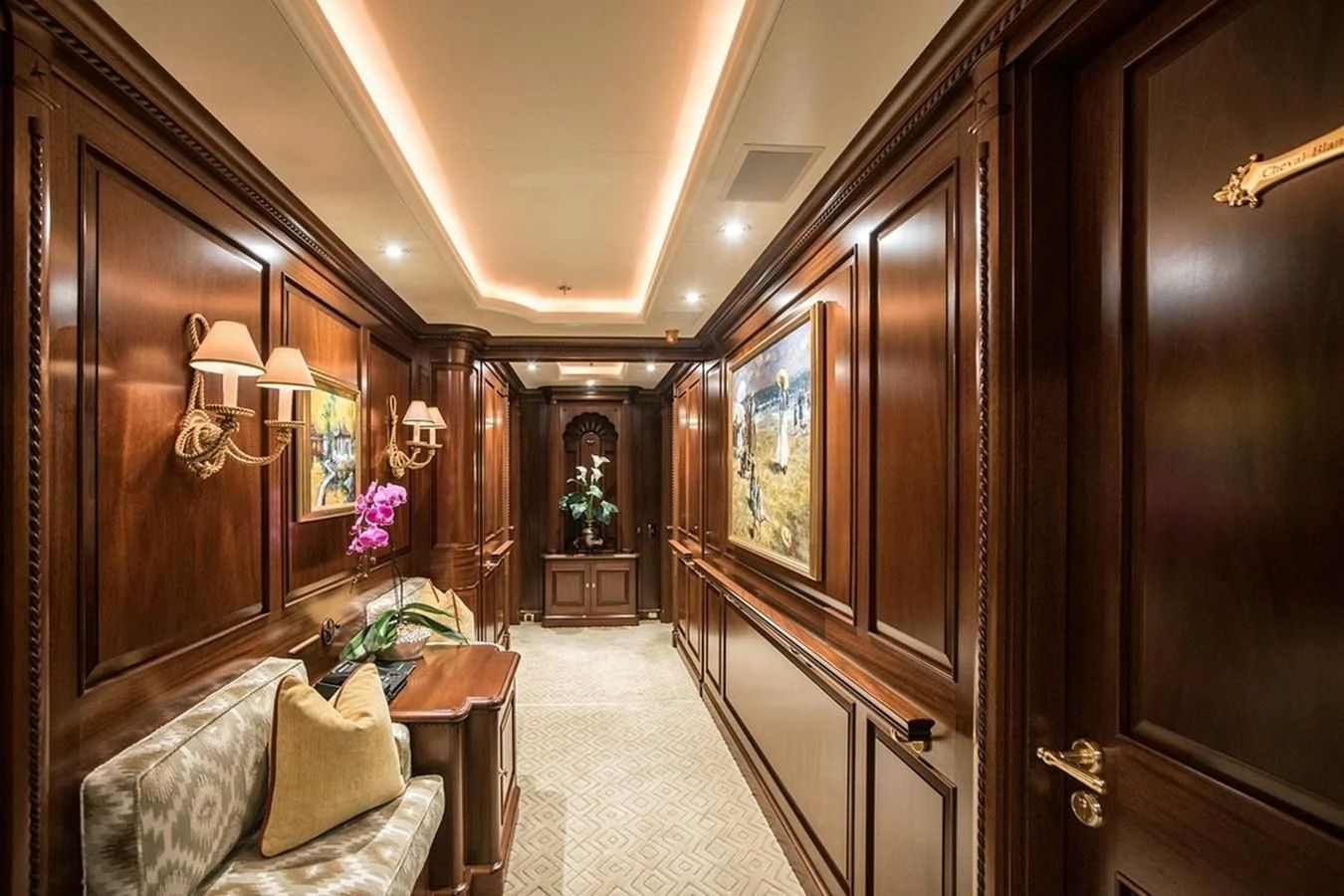 a room with a mirror and a couch aboard PARAFFIN Yacht for Sale