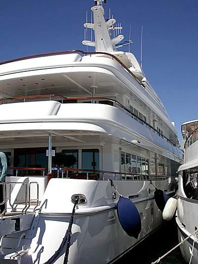 a large white boat with a blue propeller aboard PARAFFIN Yacht for Sale