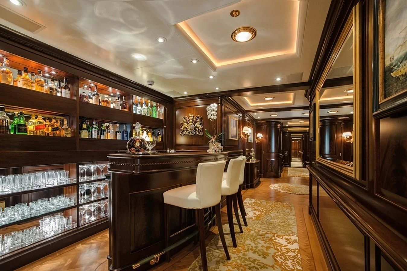 a bar with a bar and chairs aboard PARAFFIN Yacht for Sale