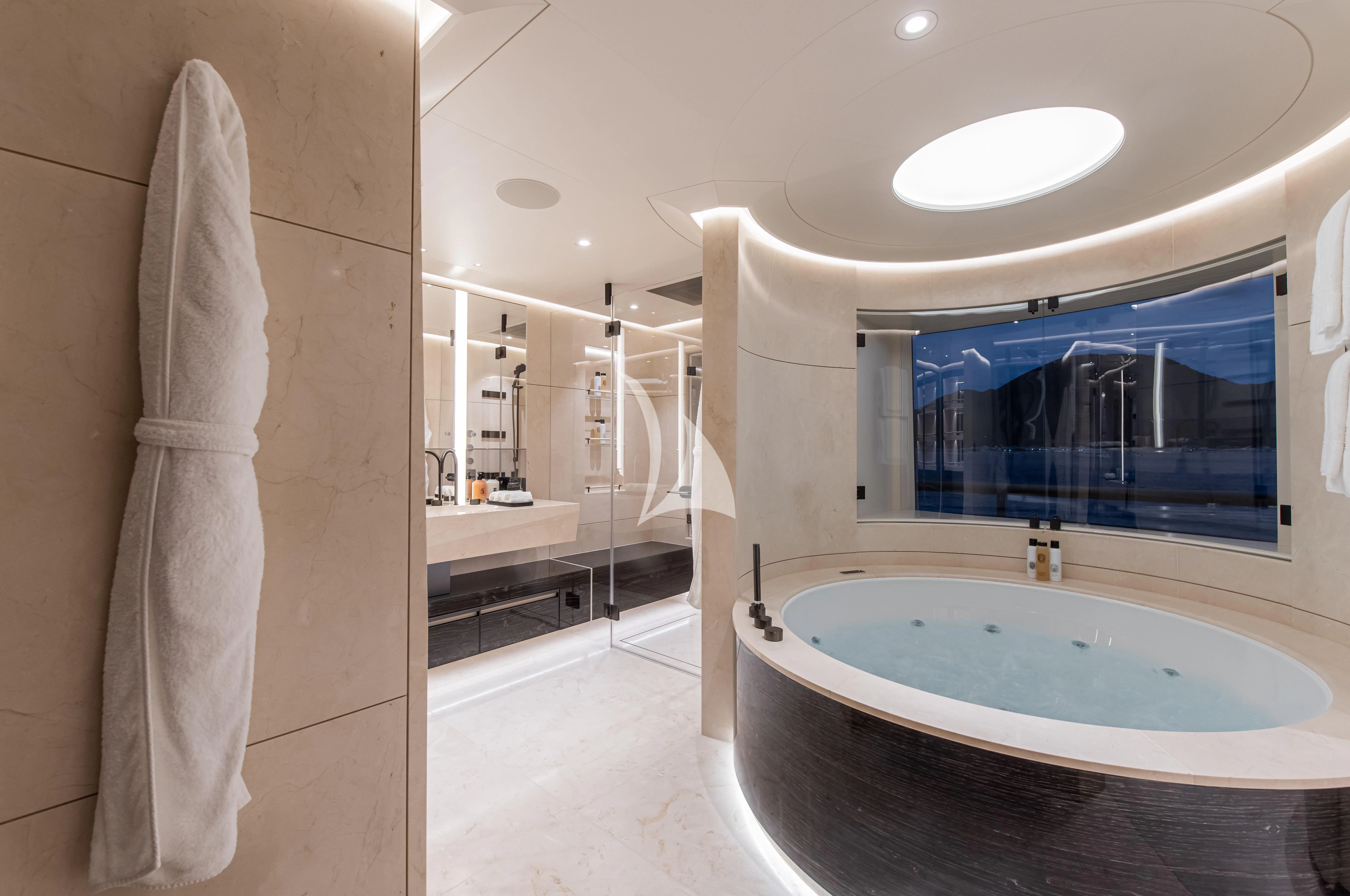 a bathroom with a large bathtub aboard SYNTHESIS Yacht for Sale