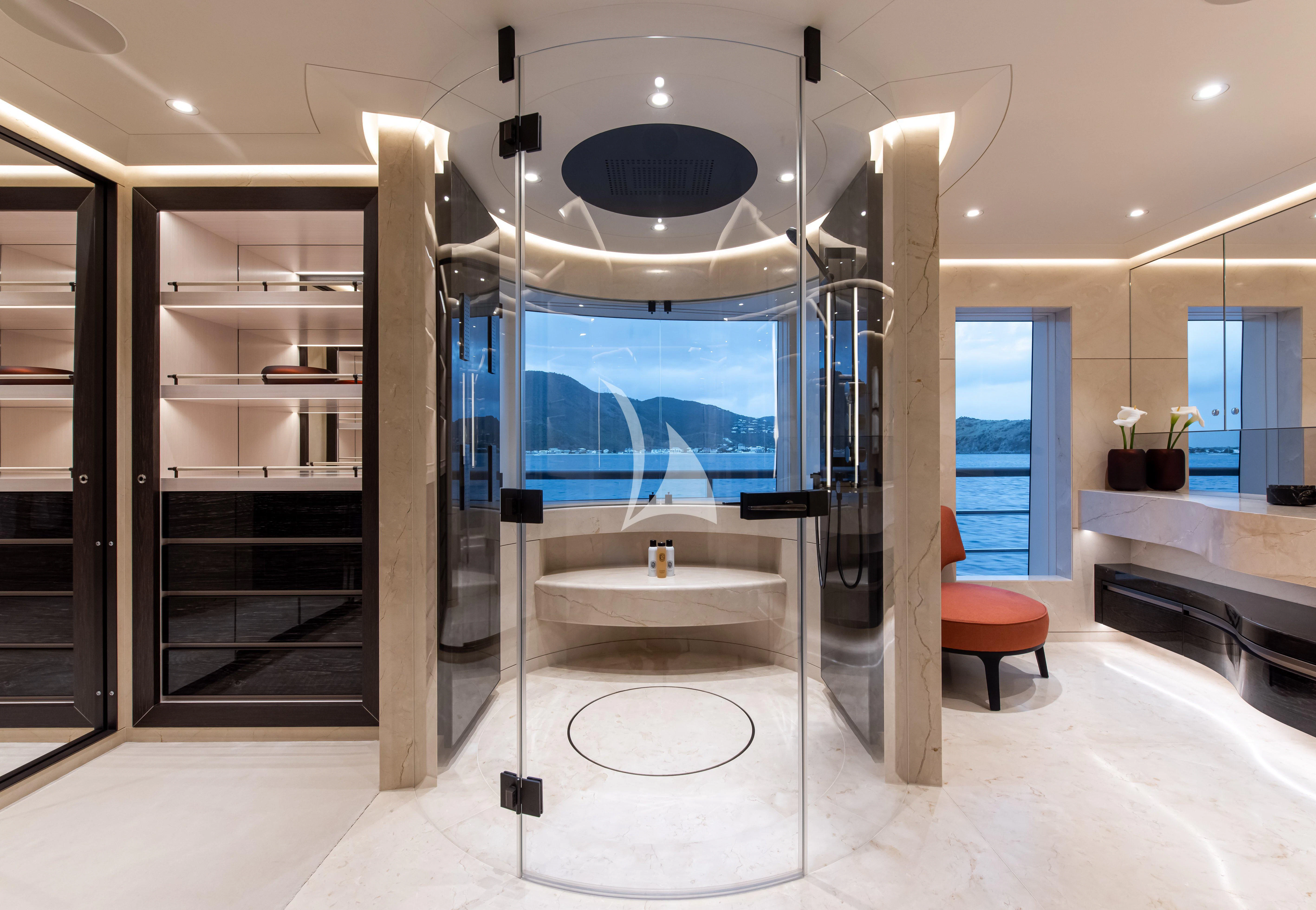 a bathroom with a large glass shower aboard SYNTHESIS Yacht for Sale