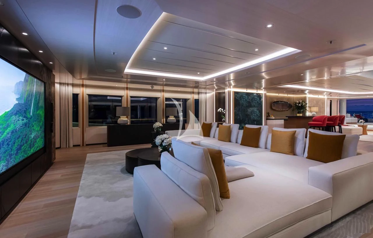 a living room with a large screen aboard SYNTHESIS Yacht for Sale