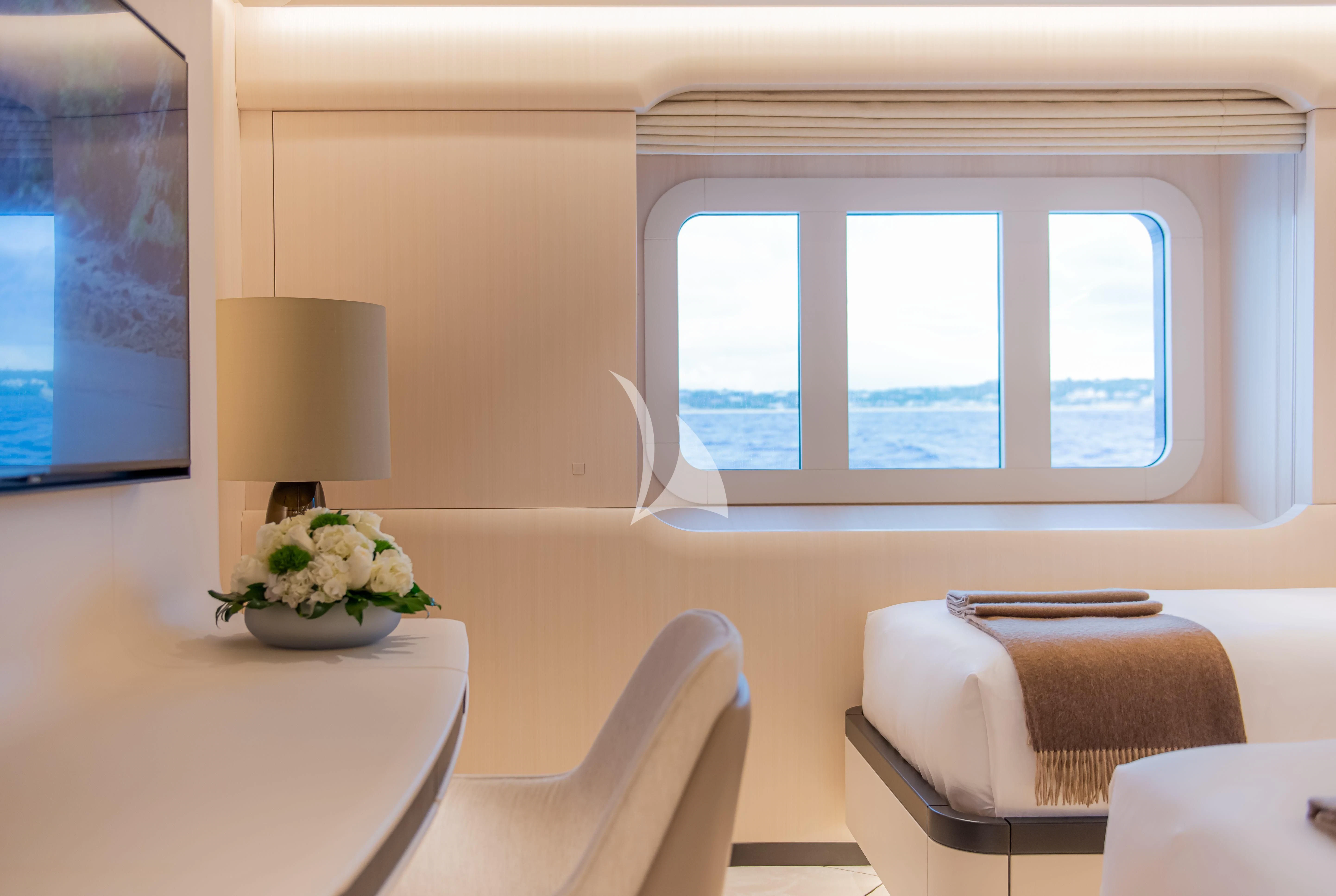 a room with a table and chairs aboard SYNTHESIS Yacht for Sale