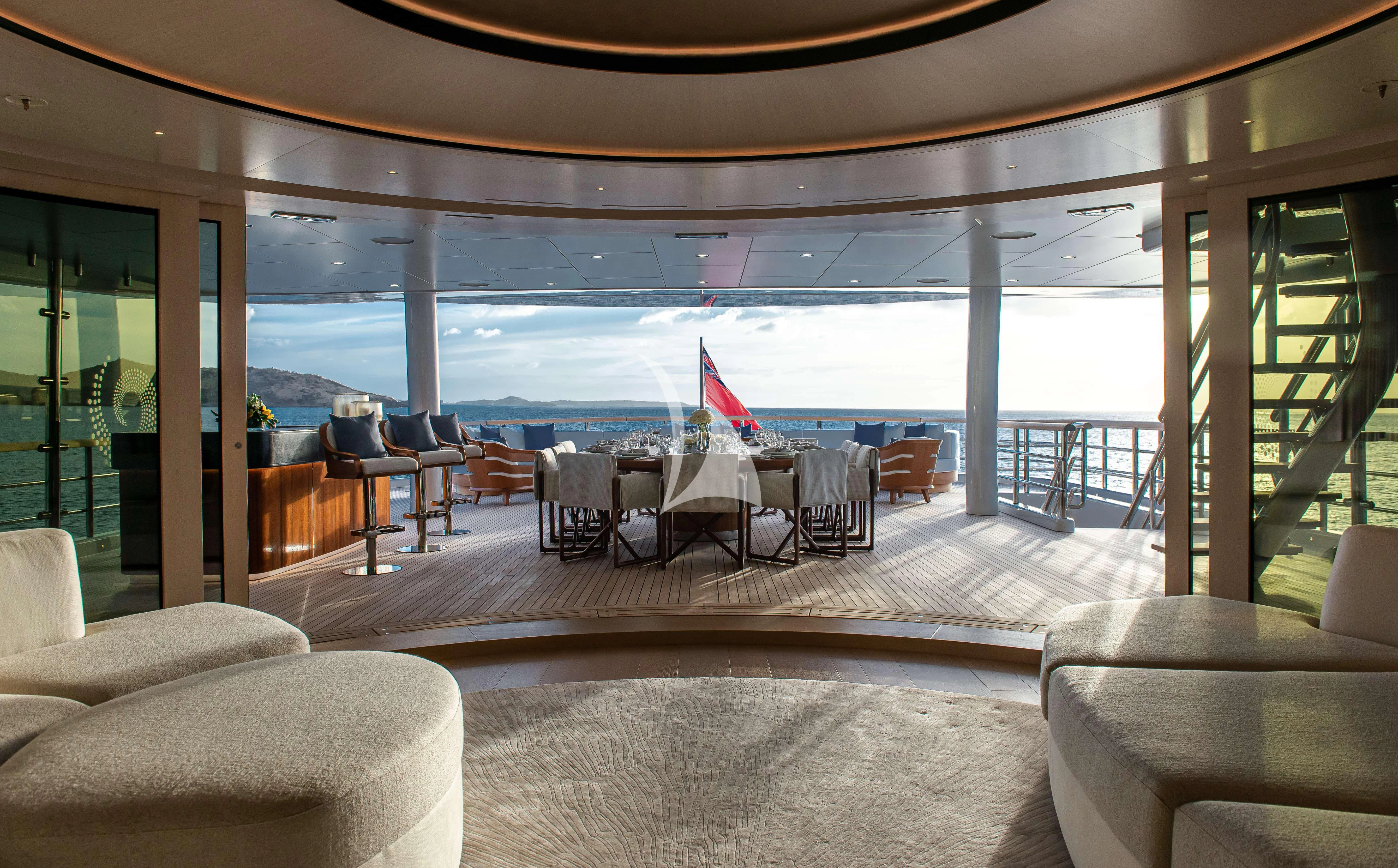 a room with a table and chairs aboard SYNTHESIS Yacht for Sale