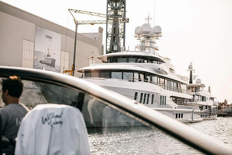 a white boat docked aboard SYNTHESIS Yacht for Sale