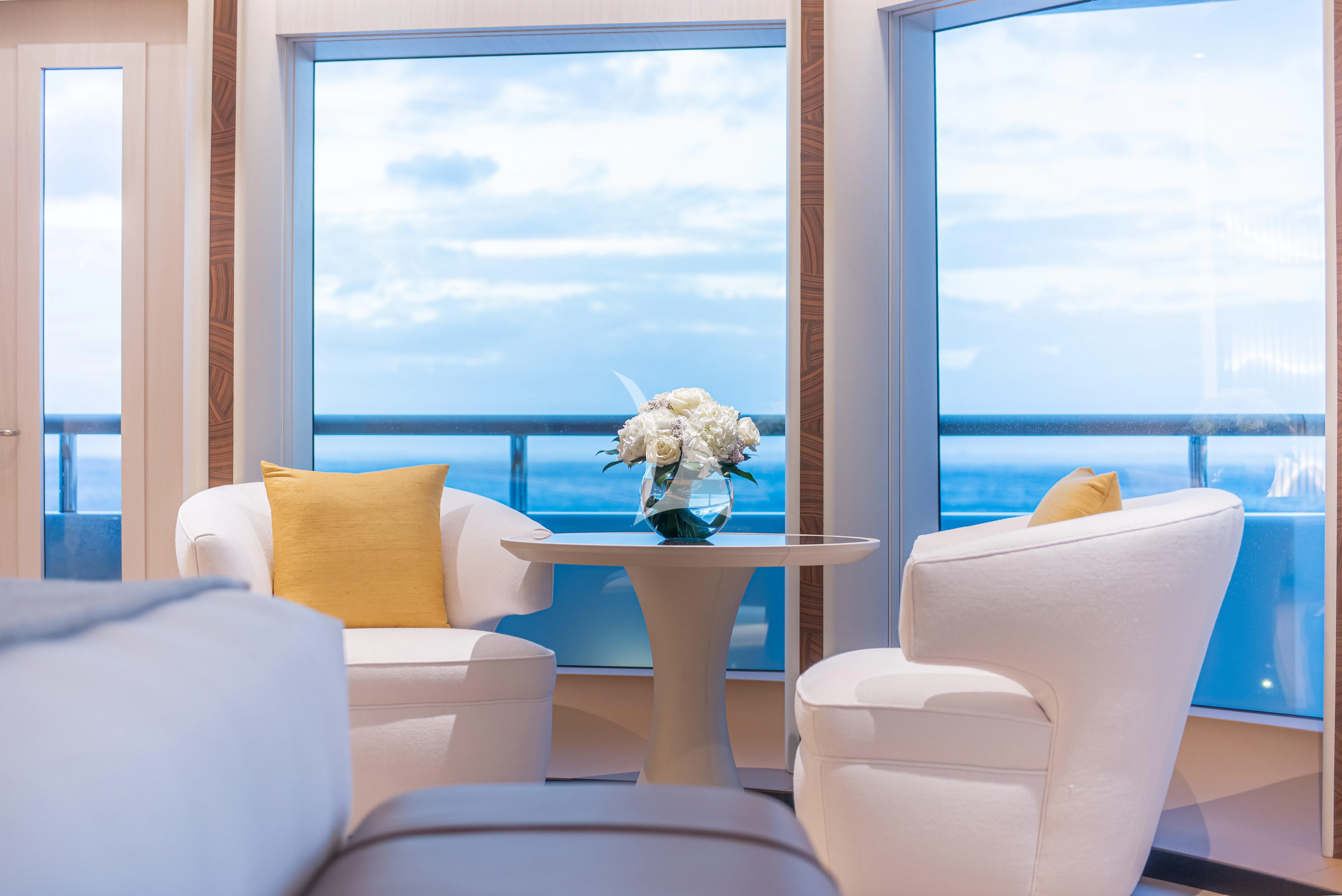 a room with a table and chairs aboard SYNTHESIS Yacht for Sale