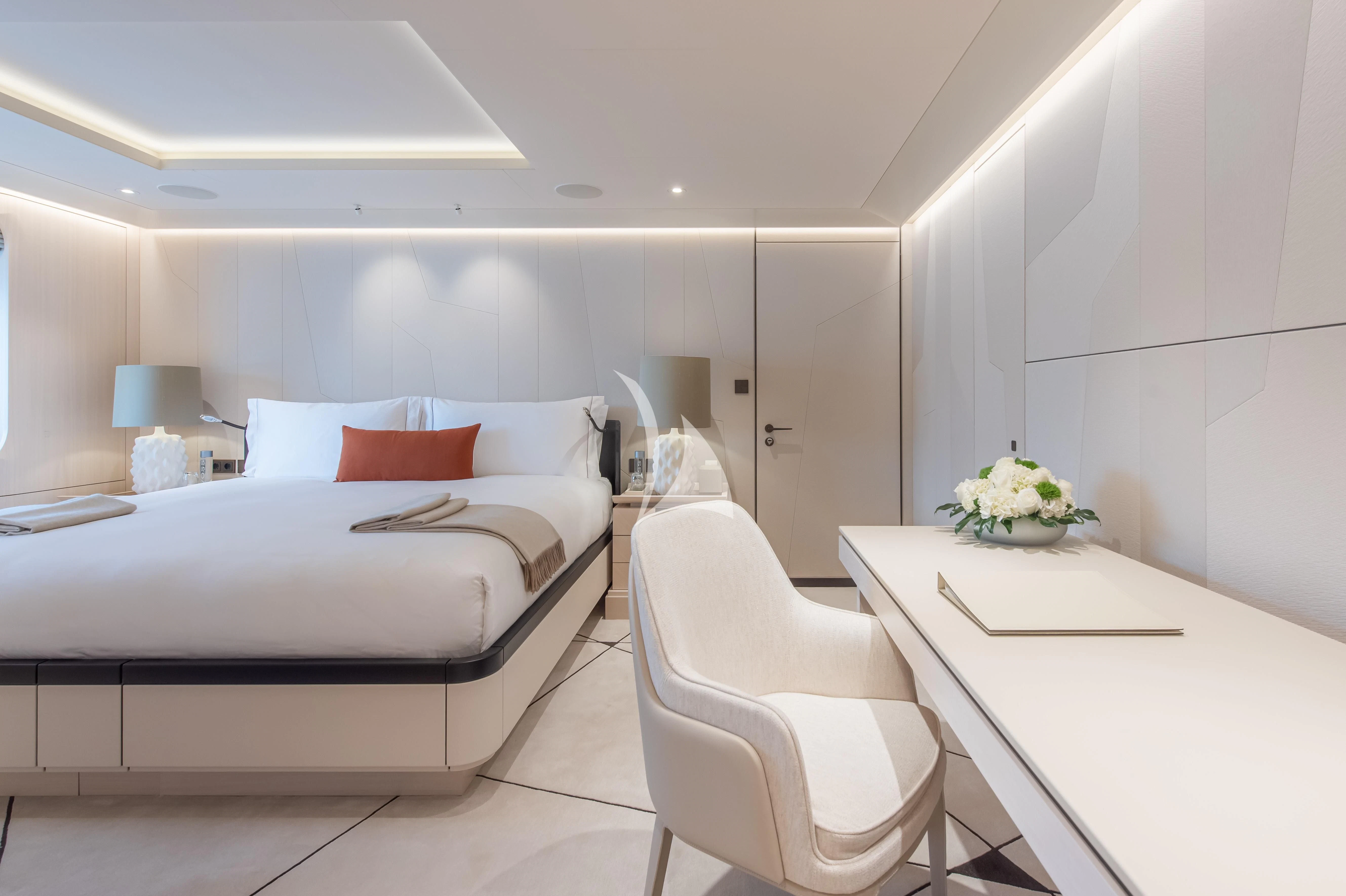 a white bedroom with a white bed aboard SYNTHESIS Yacht for Sale