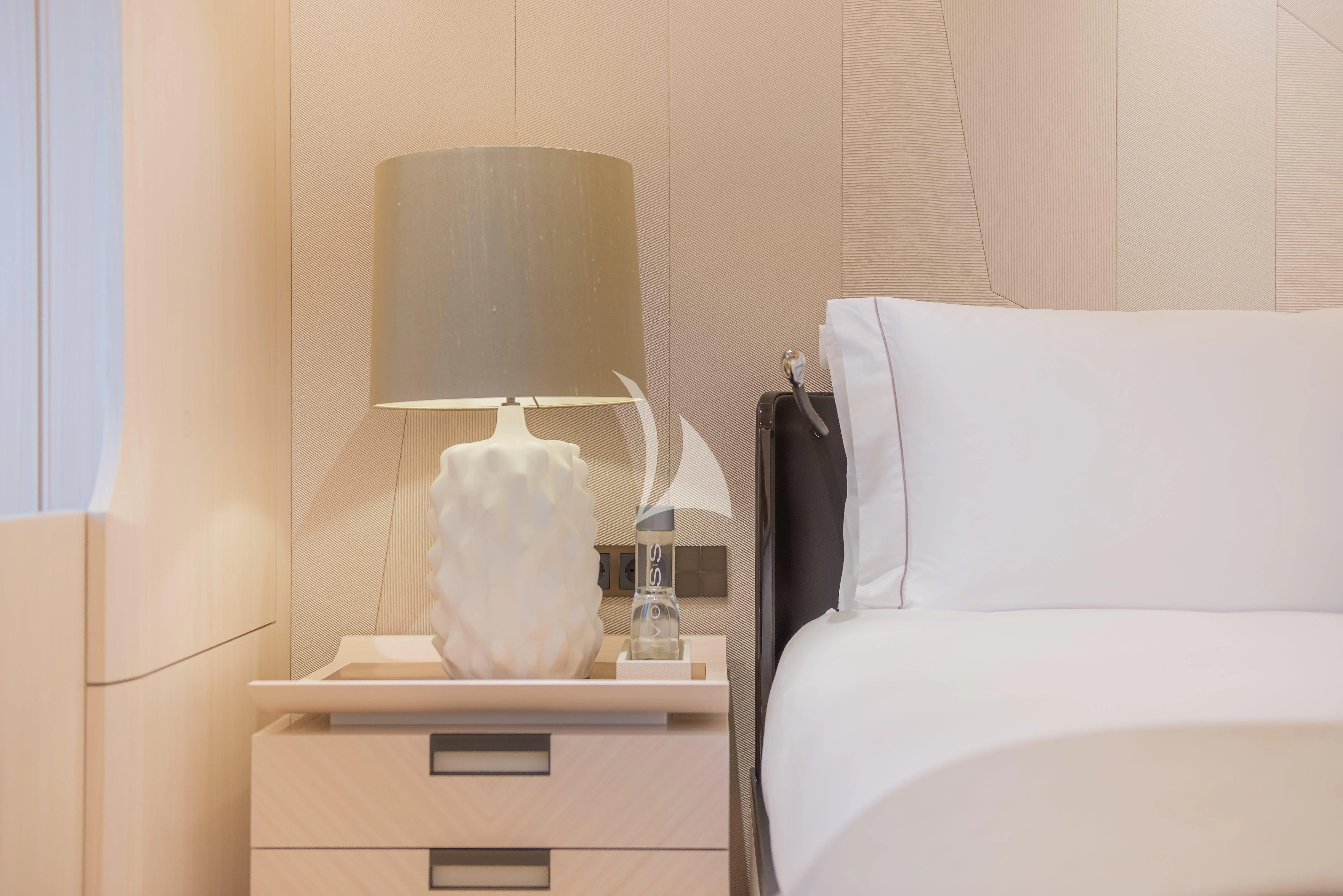 a lamp on a table aboard SYNTHESIS Yacht for Sale