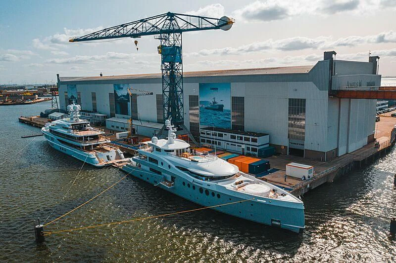 a boat tied to a dock aboard SYNTHESIS Yacht for Sale