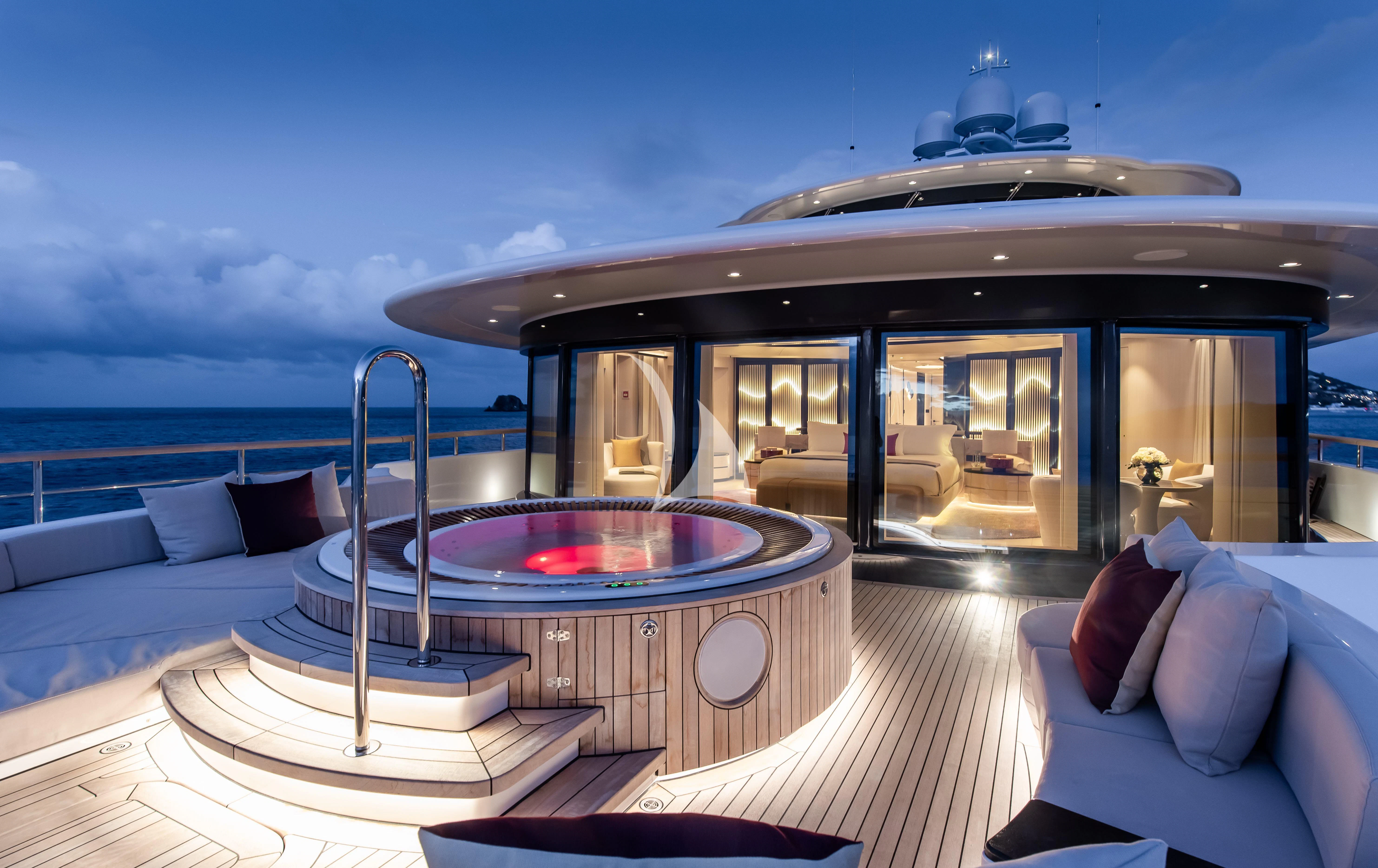 a large swimming pool on a deck aboard SYNTHESIS Yacht for Sale