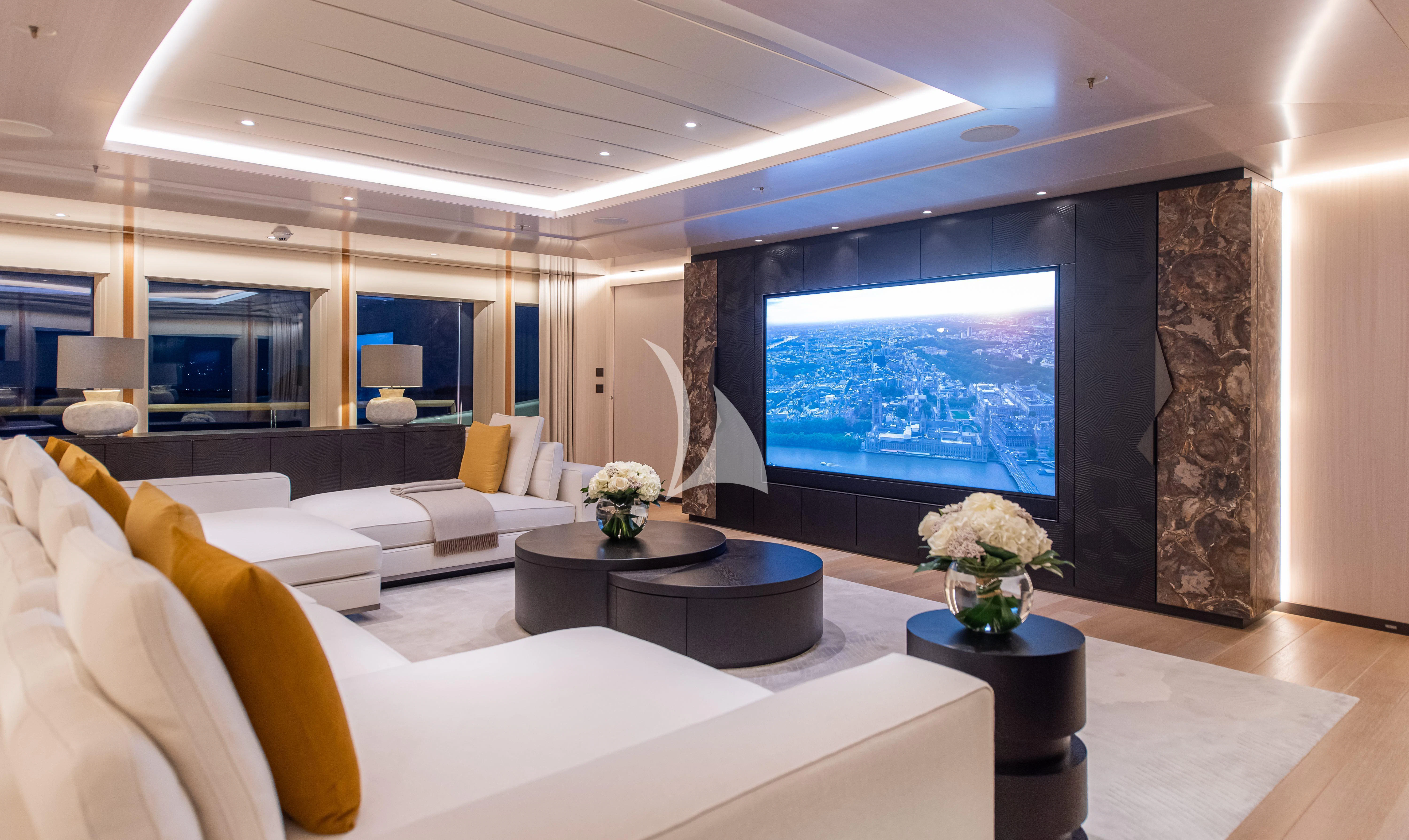a modern living room with a large window aboard SYNTHESIS Yacht for Sale