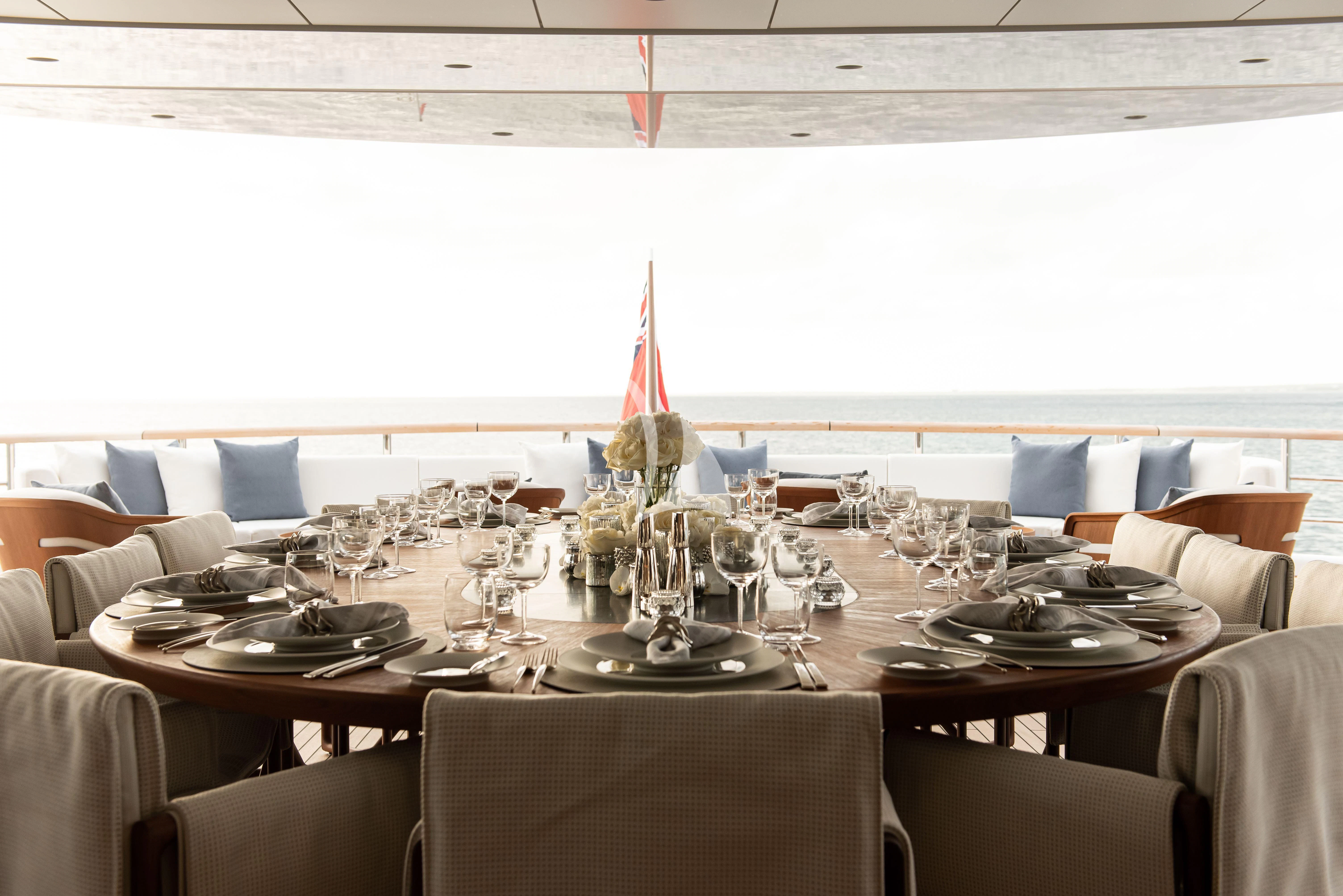 a table set for a dinner aboard SYNTHESIS Yacht for Sale