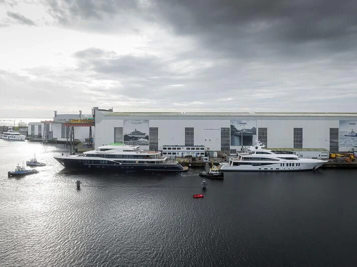a body of water with boats in it and buildings in the background aboard SYNTHESIS Yacht for Sale