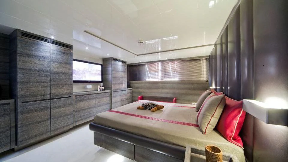 a room with a bed and a table aboard TOBY Yacht for Sale
