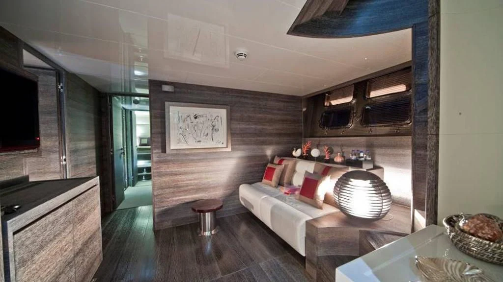 a living room with a couch and a table aboard TOBY Yacht for Sale