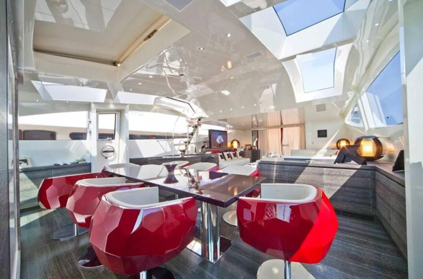 a room with a table and chairs aboard TOBY Yacht for Sale