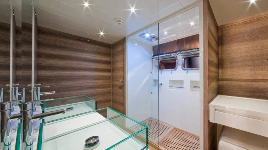 a room with a white door and a white refrigerator aboard TOBY Yacht for Sale