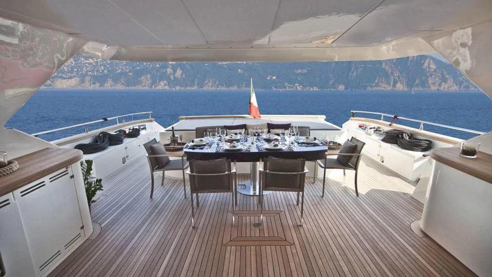 a room with a table and chairs aboard TOBY Yacht for Sale
