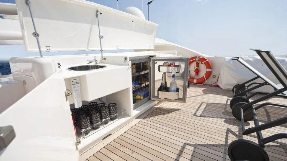 a white machine with a black object on the side aboard TOBY Yacht for Sale