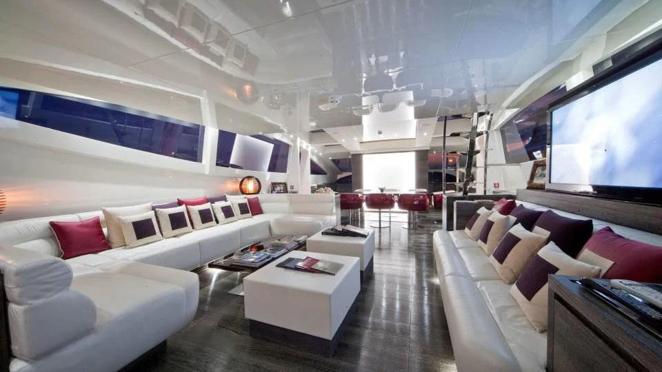 a room with a couch and a tv aboard TOBY Yacht for Sale