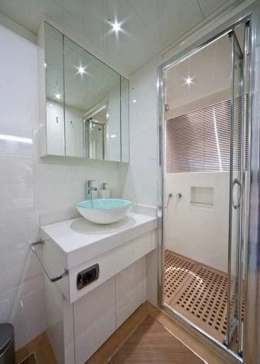 a bathroom with a sink and a shower aboard TOBY Yacht for Sale