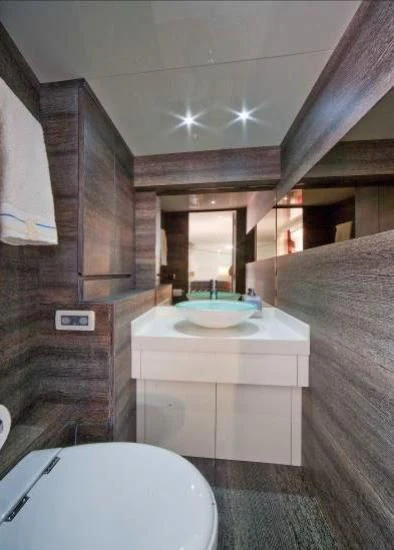 a bathroom with a sink and a toilet aboard TOBY Yacht for Sale