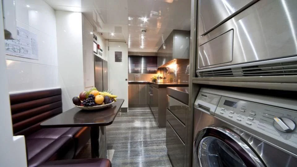 a kitchen with a bowl of fruit aboard TOBY Yacht for Sale