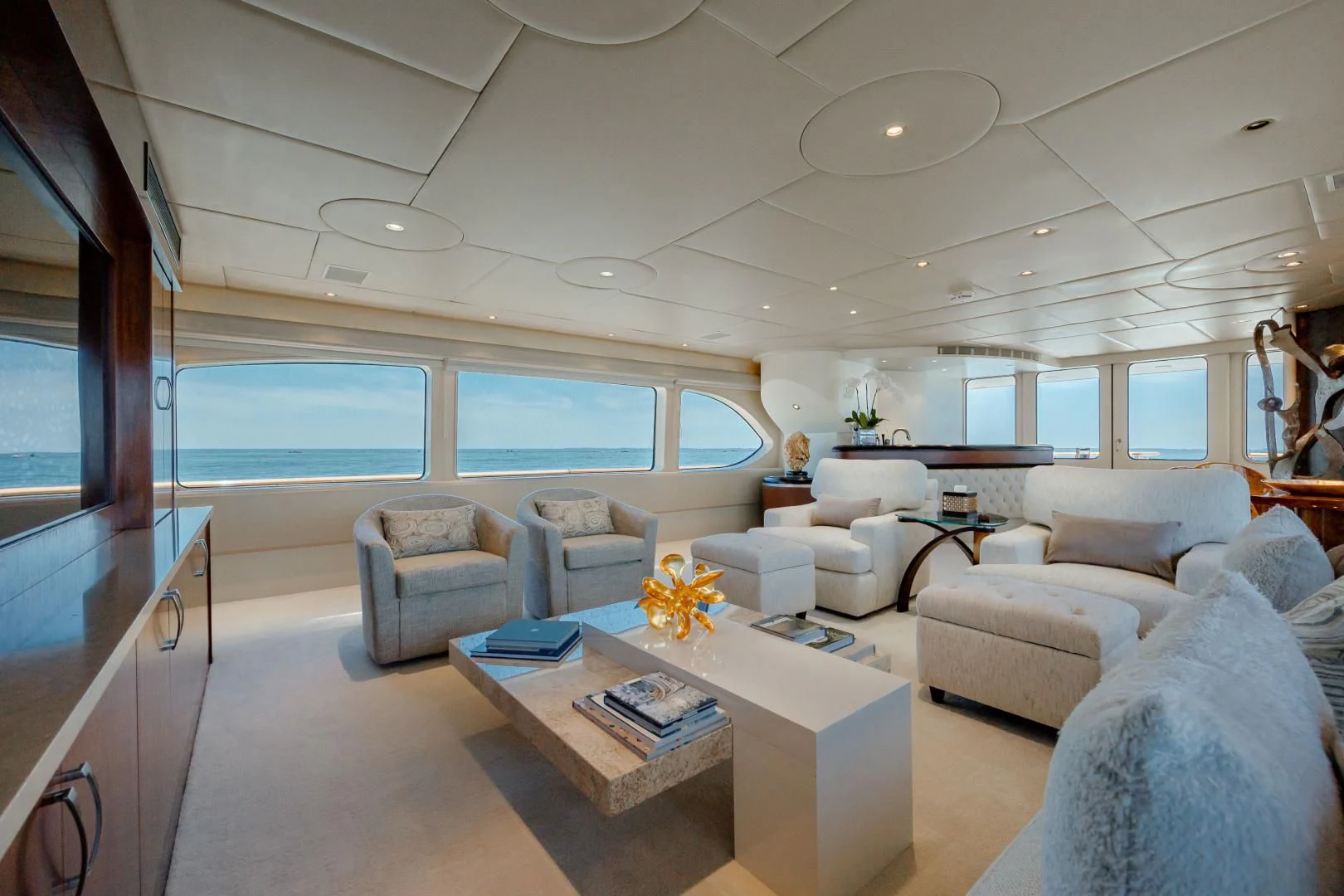 a living room with a large window aboard DREAM RIDER Yacht for Sale