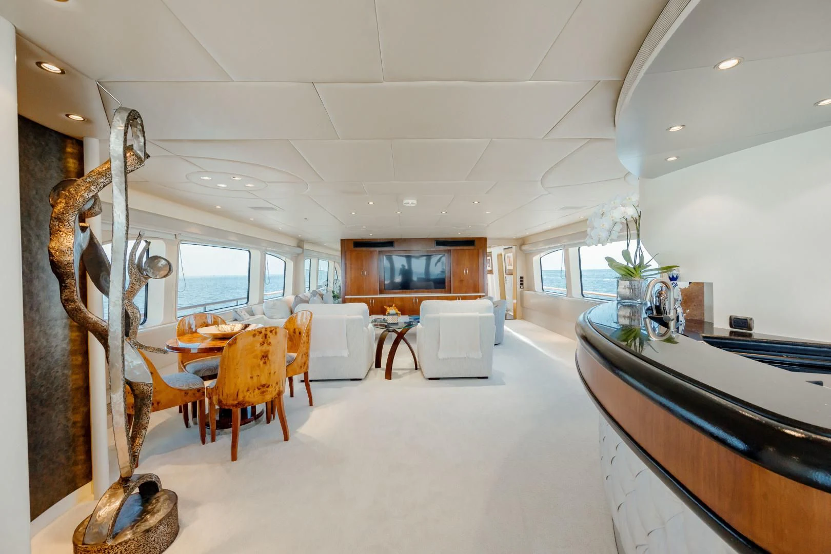 a large kitchen with a dining area aboard DREAM RIDER Yacht for Sale