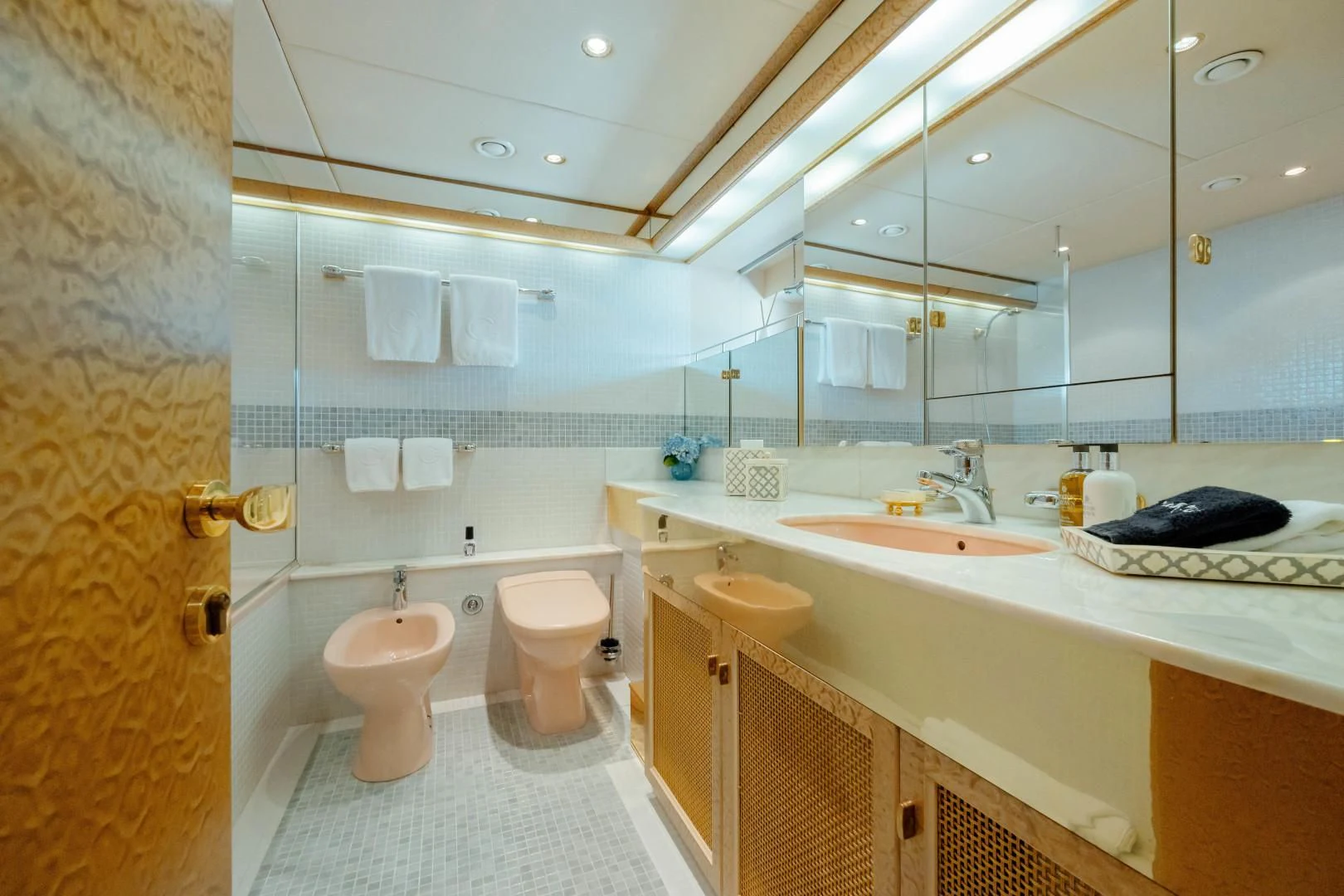 a bathroom with a large mirror aboard DREAM RIDER Yacht for Sale