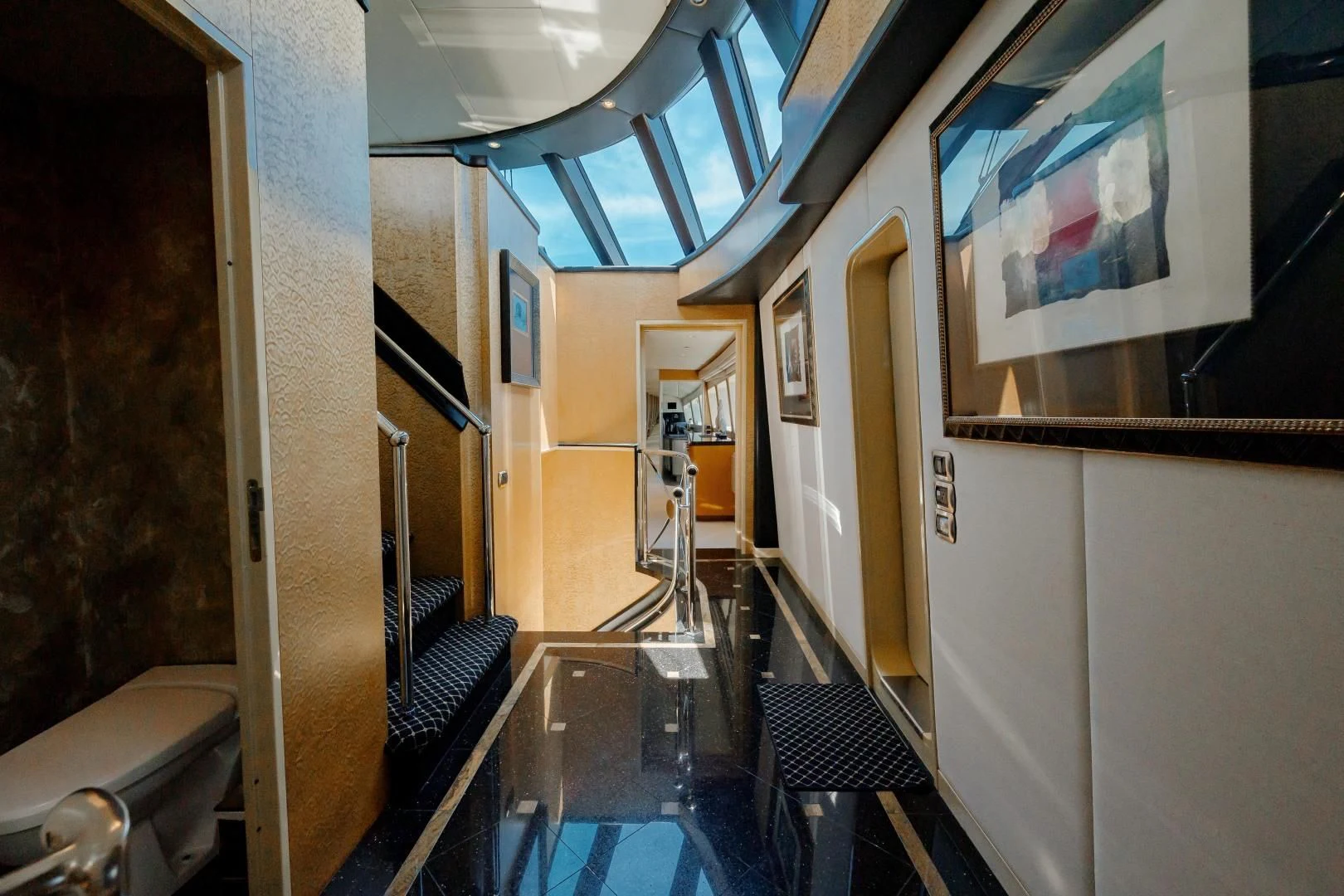 a long hallway with a glass table aboard DREAM RIDER Yacht for Sale