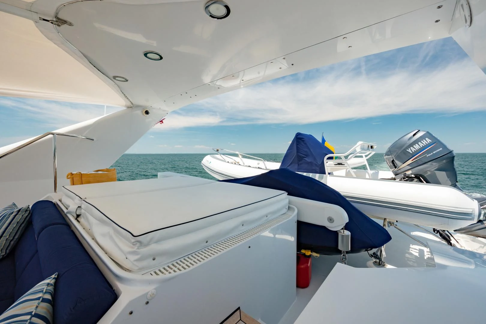 a boat with a blue cover aboard DREAM RIDER Yacht for Sale