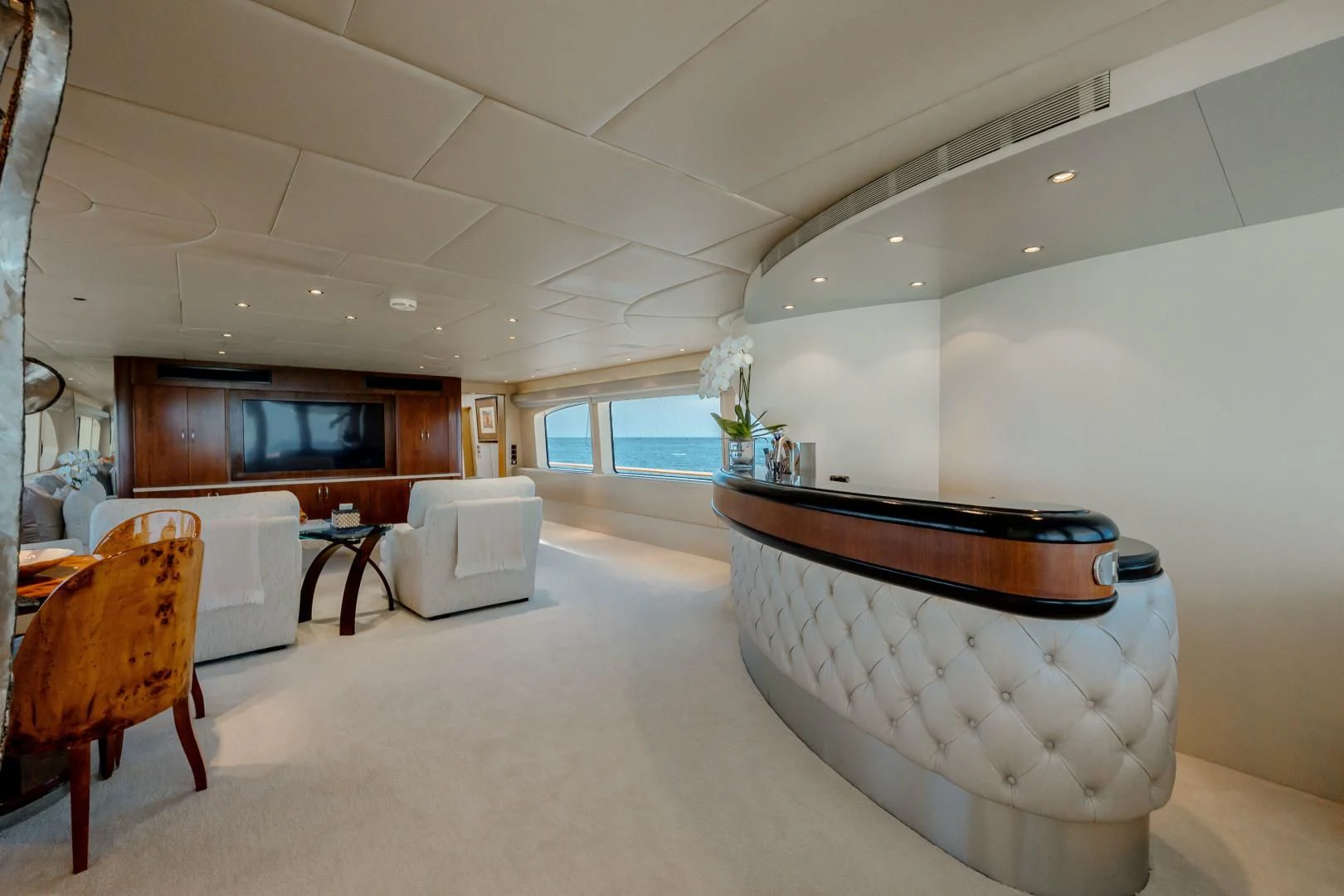a large white room with a large white tub and a wood cabinet aboard DREAM RIDER Yacht for Sale